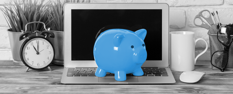 a blue piggybank on a laptop