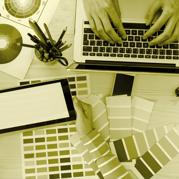 A man typing on a laptop