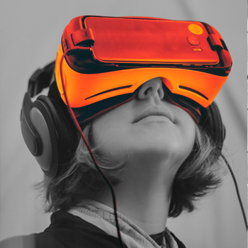 A woman wearing orange VR Goggles