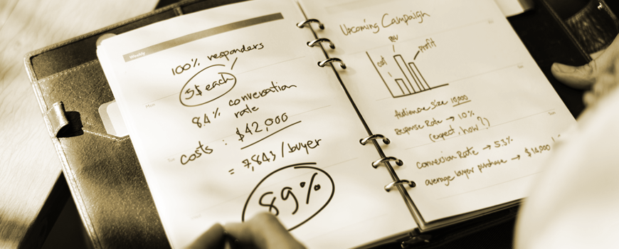 a notebook with writing and graphs