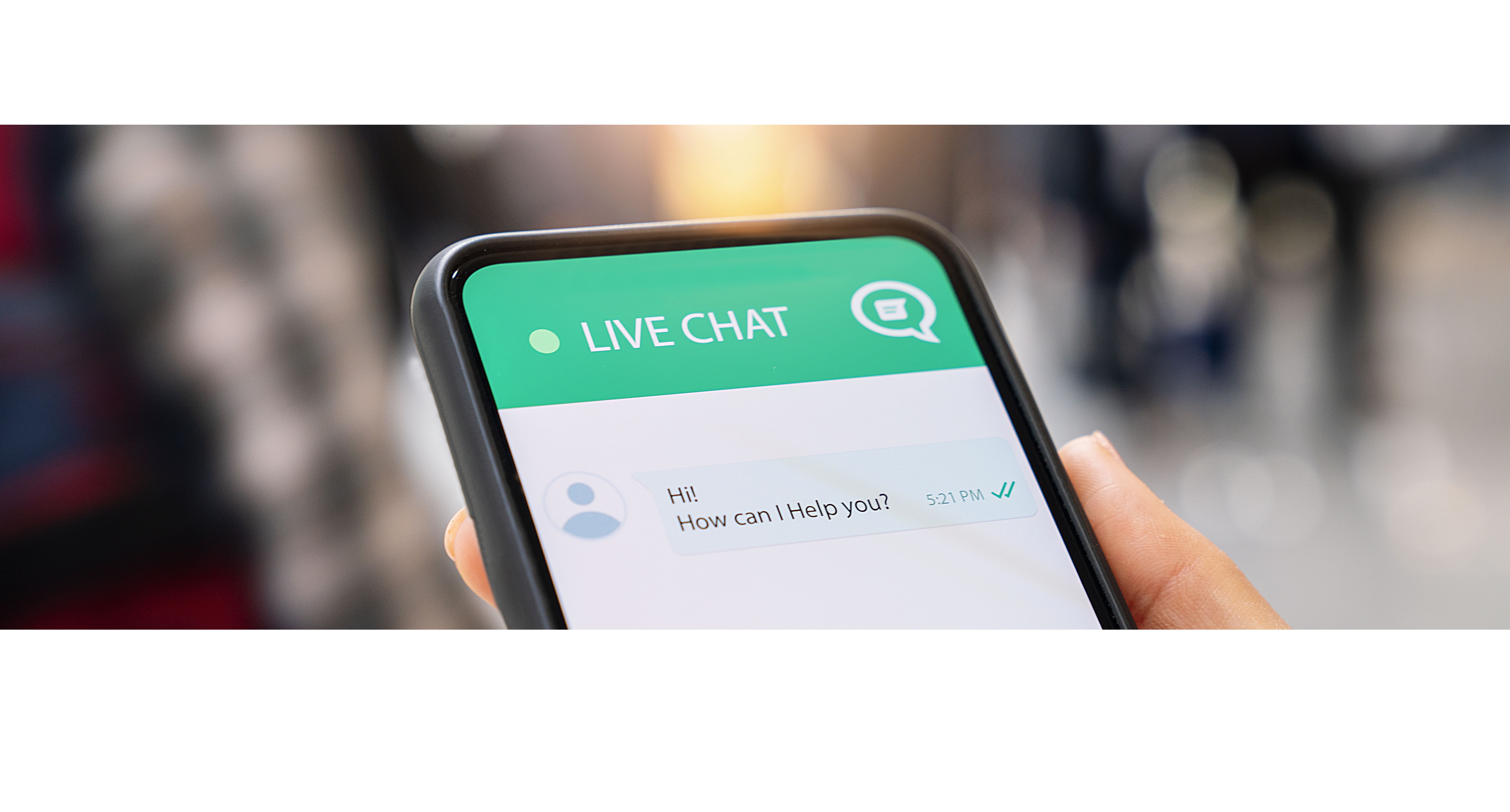 Smartphone screen showing live chat conversation with message saying “Hi! How can I help you?”