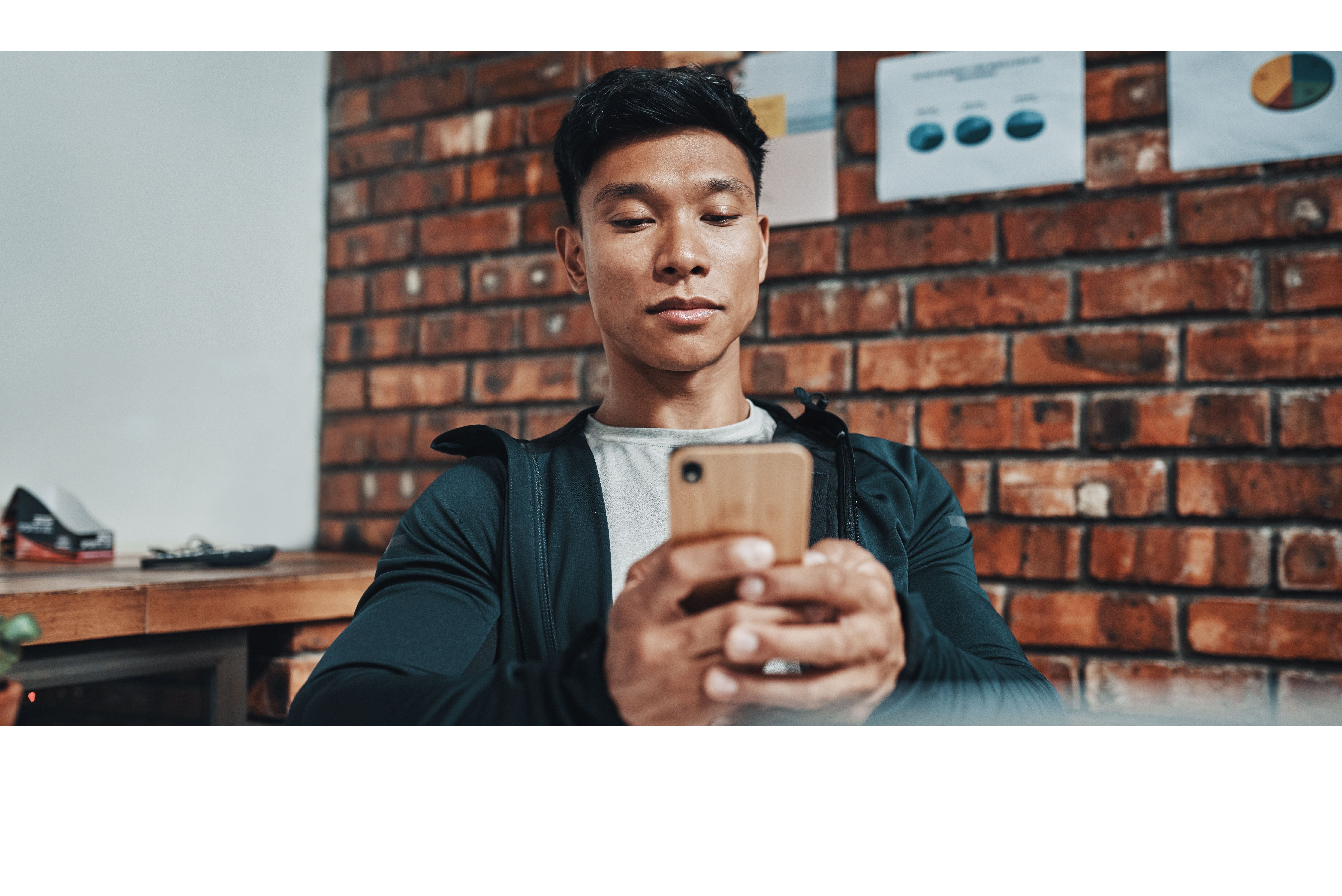 a young man staring at his phone