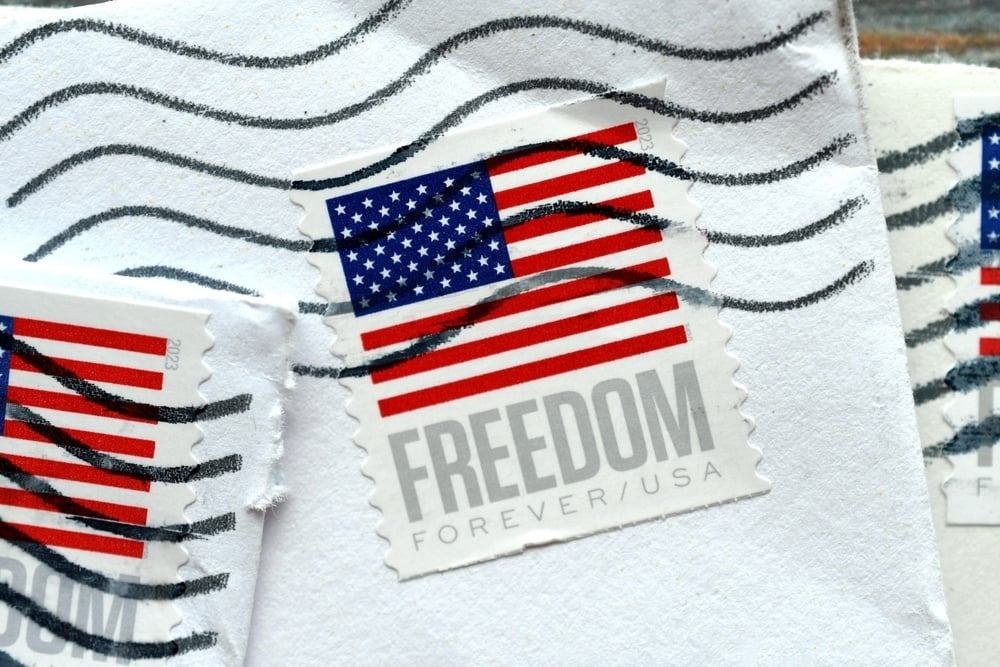 a piece of mail with a stamp that says Freedom Forever/USA