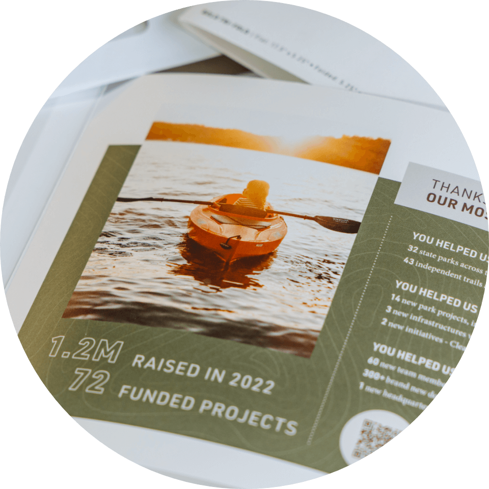 Direct mail brochure from Midwest Parks Foundation showing a kayaker on water, summarizing 2022 fundraising achievements.