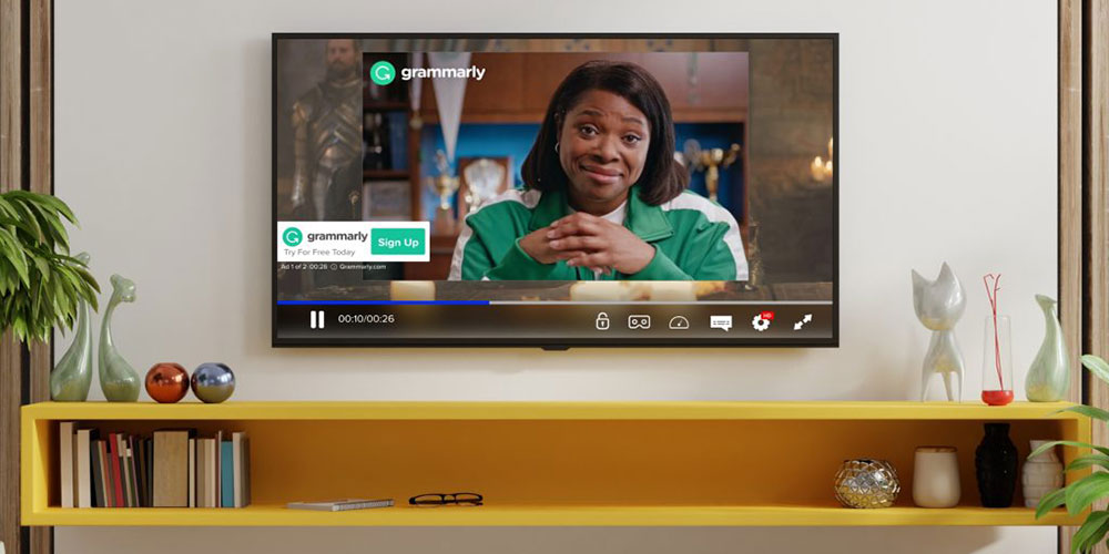 CTV advertisement example showing Grammarly brand video ad playing on connected TV in home living room